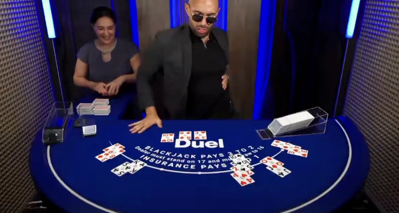 A fake Andrew Tate, known as Bottom G, dealing Duel Blackjack